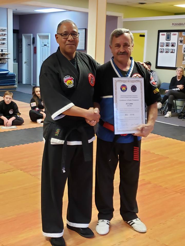 Professor Rudy Duncan promotes Professor Al Lima to 8th Degree Black Belt